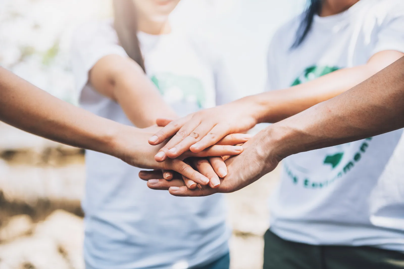 close up people volunteer teamwork putting finger star shapehands togetherstack handsunity teamwork world environment day