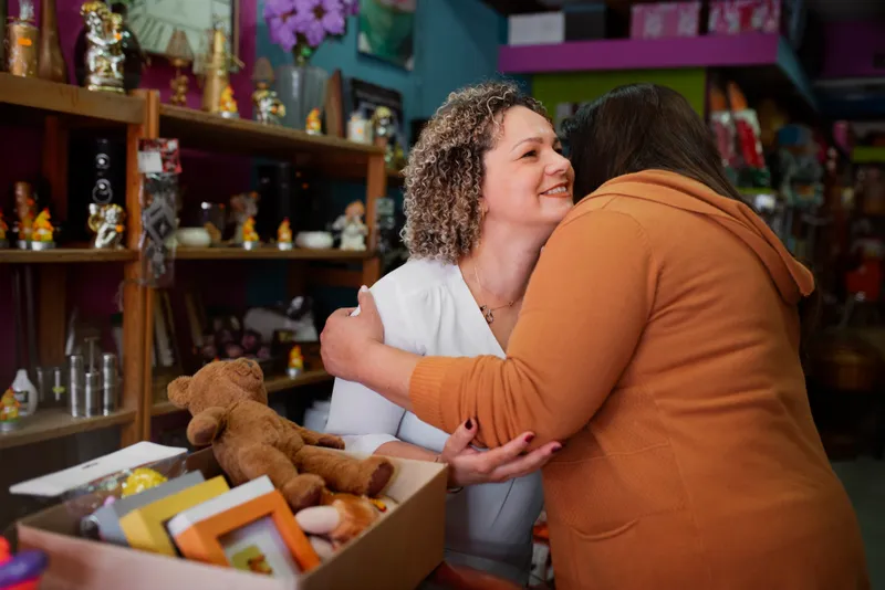 medium shot women hugging
